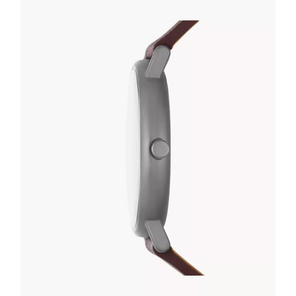 Skagen SKW6860 with ultra-slim gunmetal-tone case profile, minimalist crown, and brown leather strap attachment.