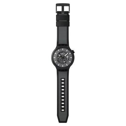 Swatch Big Bold Past the Horizon SB05B113 watch with a dark openworked dial, black case, full-length black strap with gray textured detailing, adjustment holes, and black buckle.