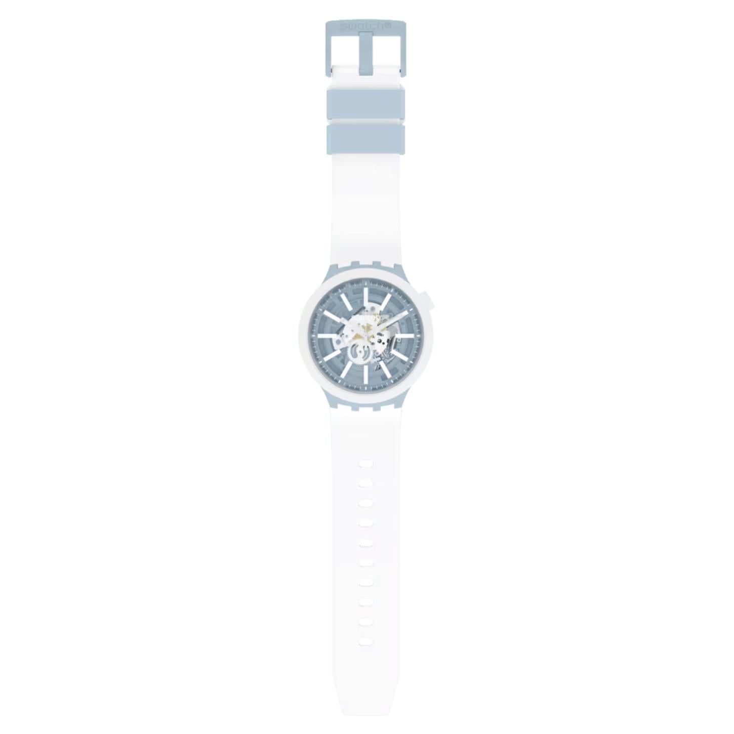 Swatch Big Bold Whice SB03N103 watch with a transparent blue openworked dial, white case, full-length white strap, adjustment holes, and light blue buckle.