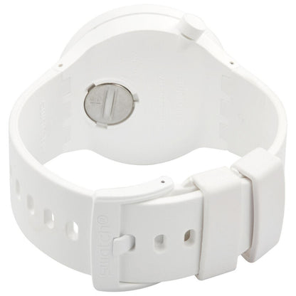 Swatch C-White SB03W100 from the rear with a white Bioceramic caseback, matching white strap, white buckle, and integrated strap keepers.