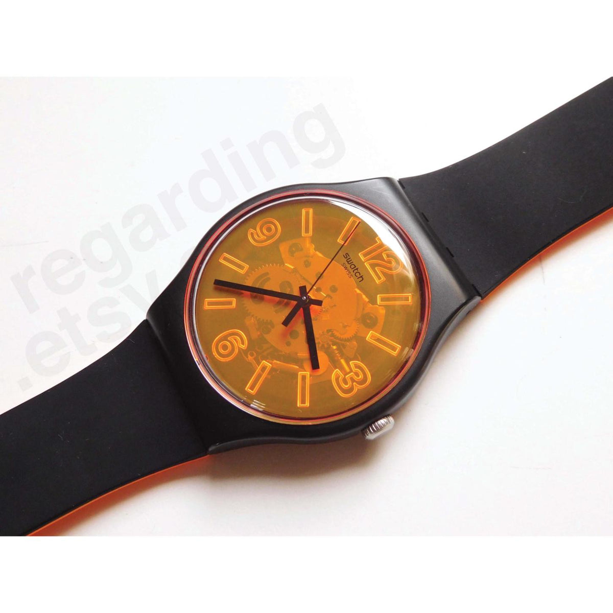 Swatch Orangeboost SUOB164 with a transparent orange dial, visible movement, orange numerals, black case, black hands, and black strap with orange edging.
