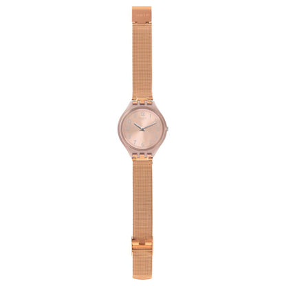 Swatch Skinchic SVUP100M with rose gold-tone dial and case, full matching mesh bracelet, silver-tone Arabic numerals and hands, and integrated clasp.