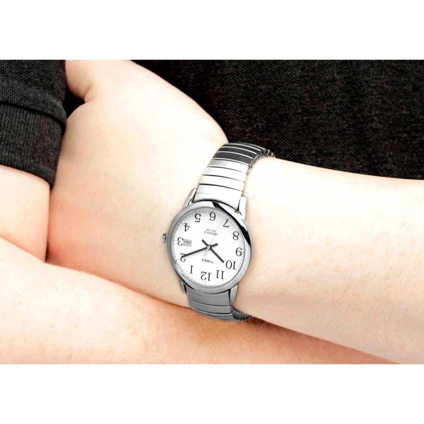 Timex Easy Reader 35mm men’s watch with white dial and stainless steel expansion bracelet worn on the wrist.