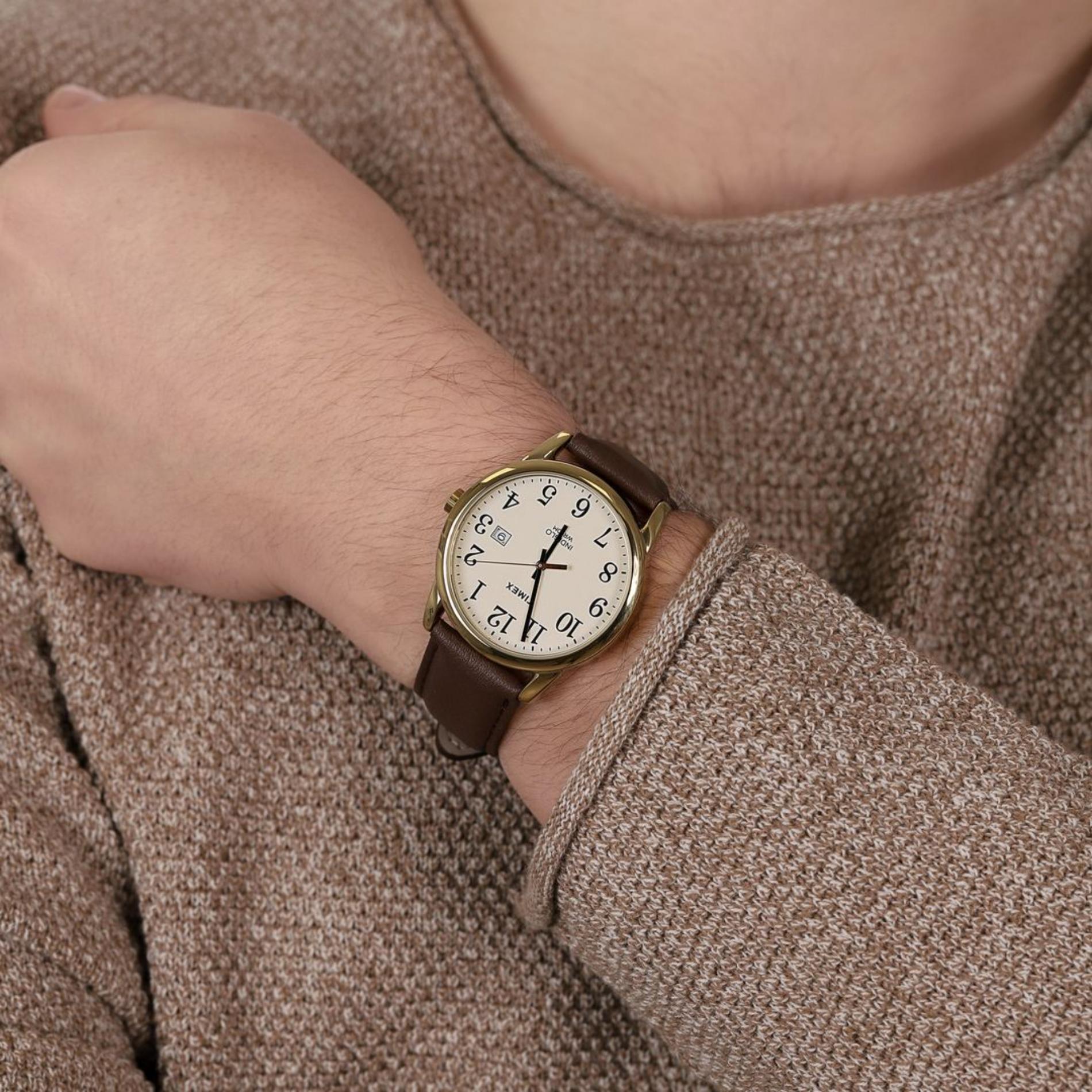 Timex Easy Reader TW2P75800 men’s watch with cream dial, gold-tone case, and brown leather strap worn on the wrist.