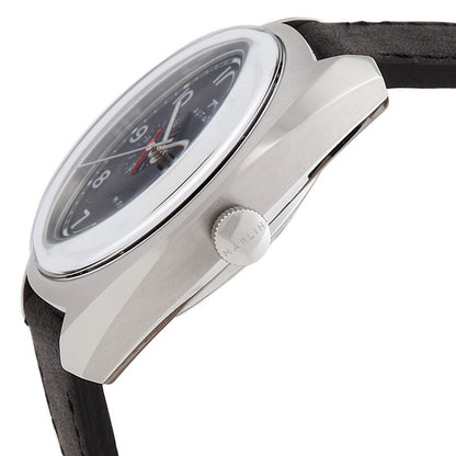 Timex Marlin TW2V62100 with domed crystal, brushed silver-tone cushion case, Marlin-branded crown at 3 o’clock, black dial, and black leather strap.