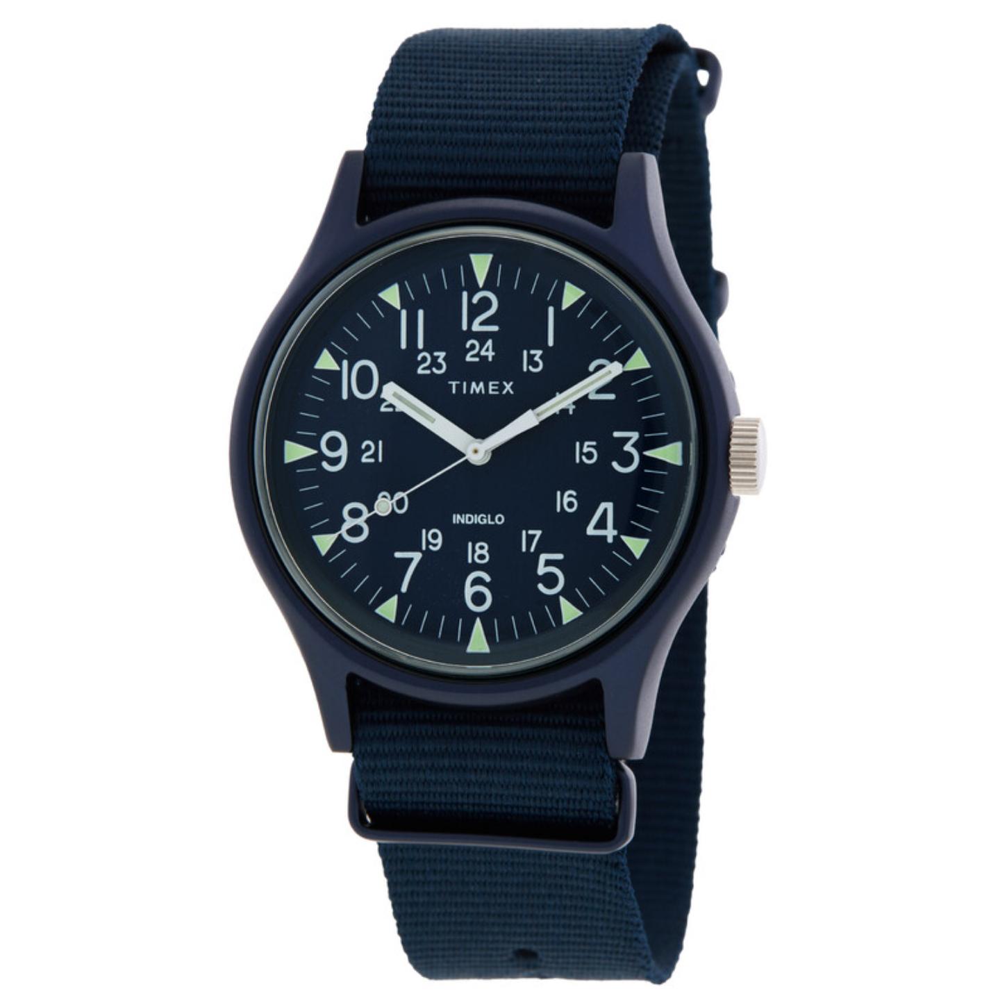 Timex MK1 TW2R37300 with a blue dial, white Arabic numerals, luminous hour markers, blue aluminum case, and matching fabric strap.