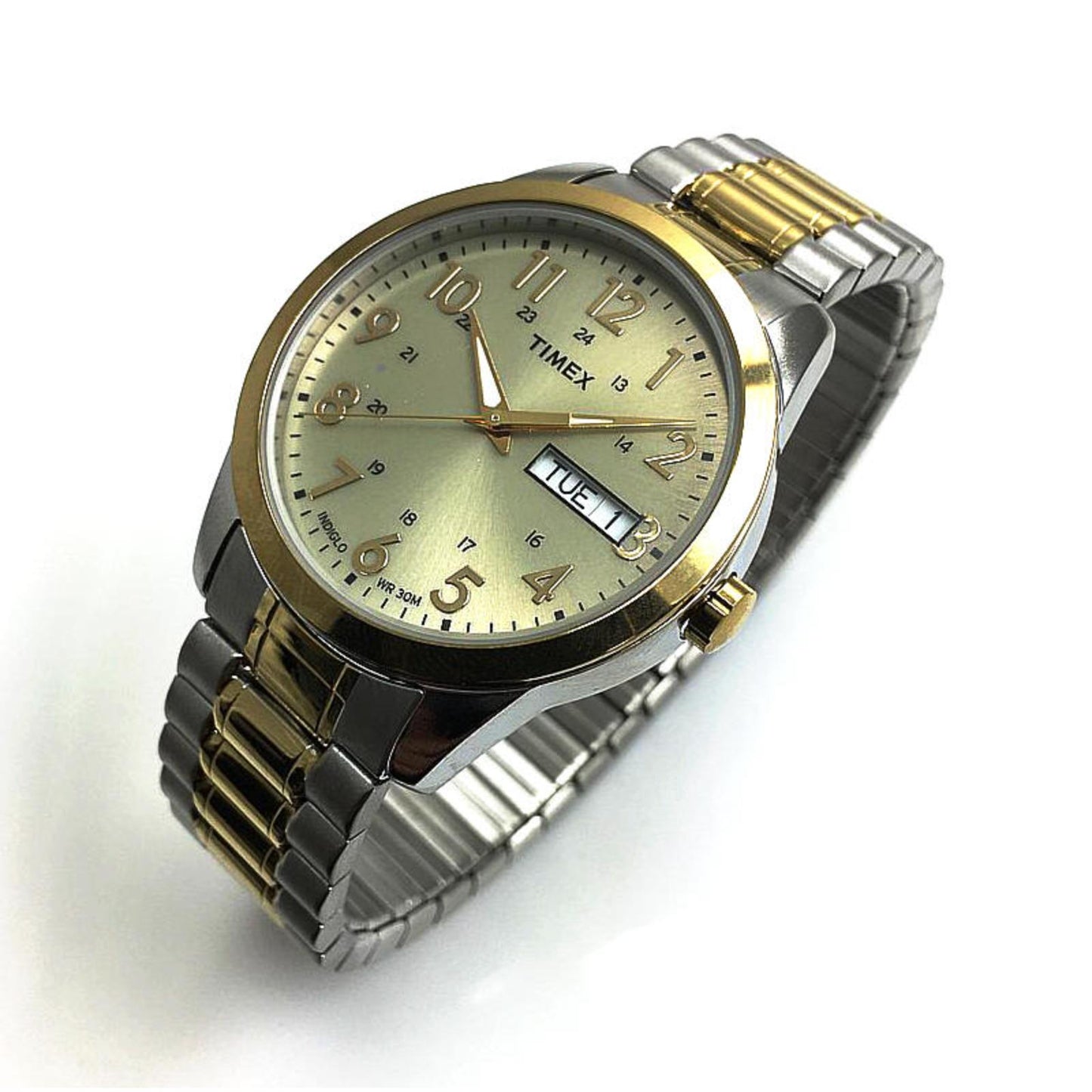 Timex South Street Sport T2M935 watch with champagne dial, day-date display, gold-tone bezel, and two-tone stainless steel expansion bracelet shown in an angled view.