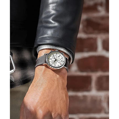 Timex Standard Chronograph TW2V43800 with a cream chronograph dial, silver-tone case, and black textured strap worn on the wrist.