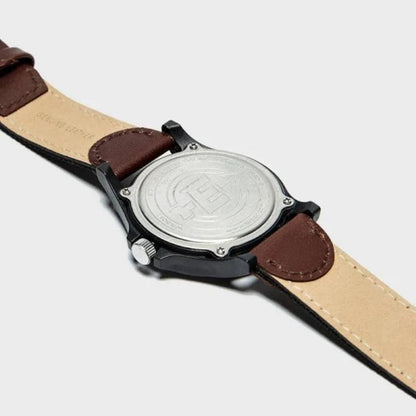 Timex TW4B08200 with stainless steel caseback, black case and brown leather and fabric strap with stitched details.