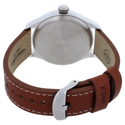 Timex Waterbury TW2P84000 with engraved silver-tone caseback, brown leather strap with contrast stitching, metal buckle, and crown visible from the rear.