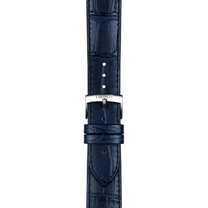 Close-up of the blue alligator-grain leather strap and stainless steel buckle of the Tissot Carson Premium Powermatic 80 T122.407.16.043.00, highlighting the premium leather texture, stitching, and signed Tissot clasp.