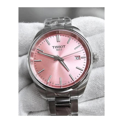Tissot PR 100 T150.210.11.331.00 with pink sunray dial, silver-tone hands and indexes, date display at 3 o’clock, and stainless steel bracelet in close-up view.
