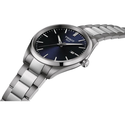Tissot T127.410.11.041.00 quartz watch with blue dial, date display and stainless steel bracelet shown at an angle.