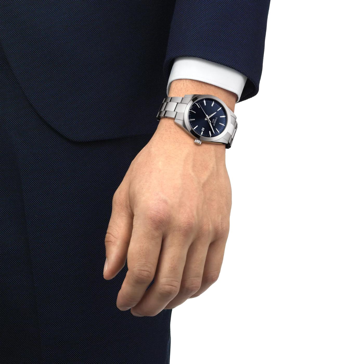 Tissot T127.410.11.041.00 quartz watch worn on the wrist with blue dial and stainless steel bracelet.
