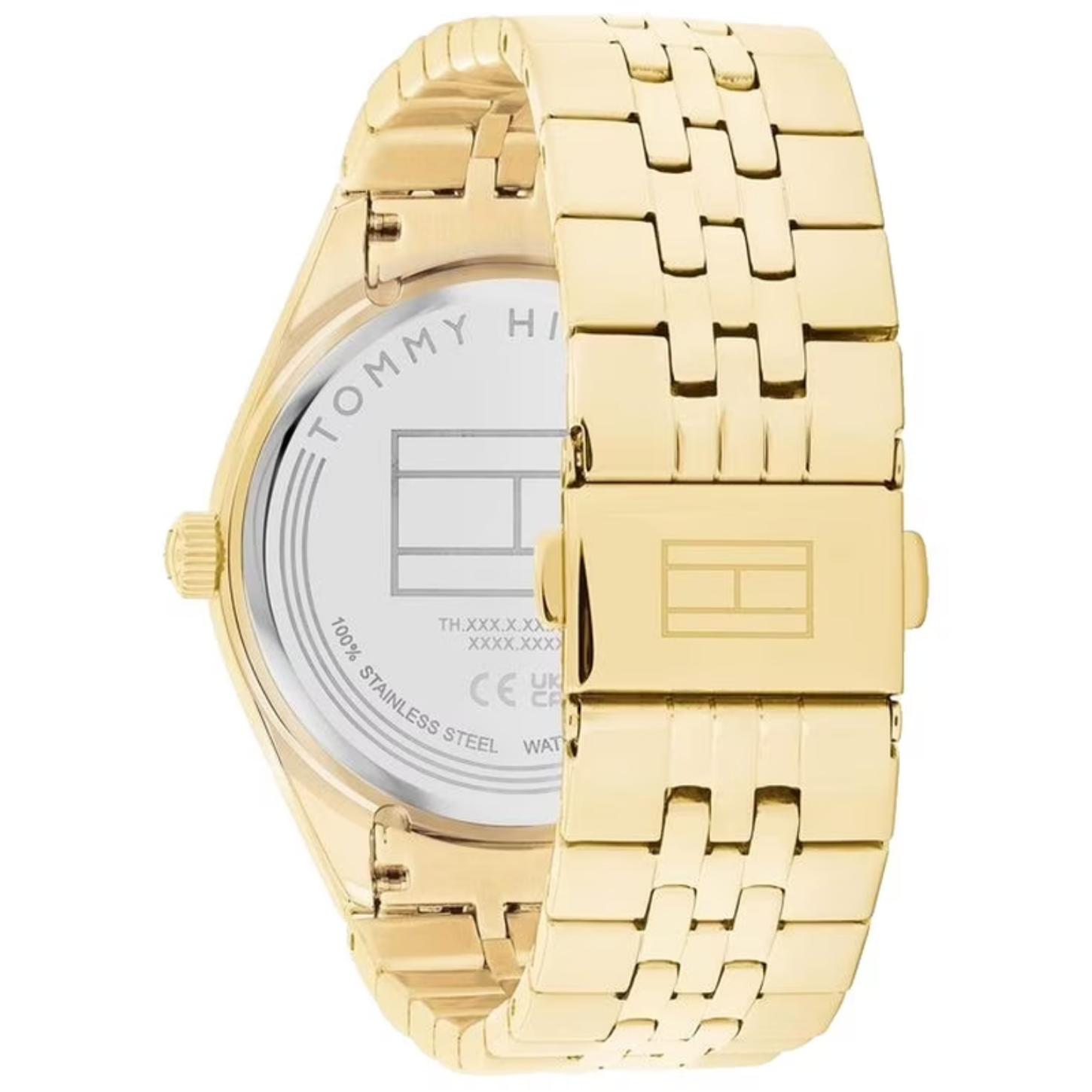 Tommy Hilfiger 1782717 rear view showing the stainless steel caseback, gold-tone stainless steel bracelet, and fold-over clasp with logo detail.