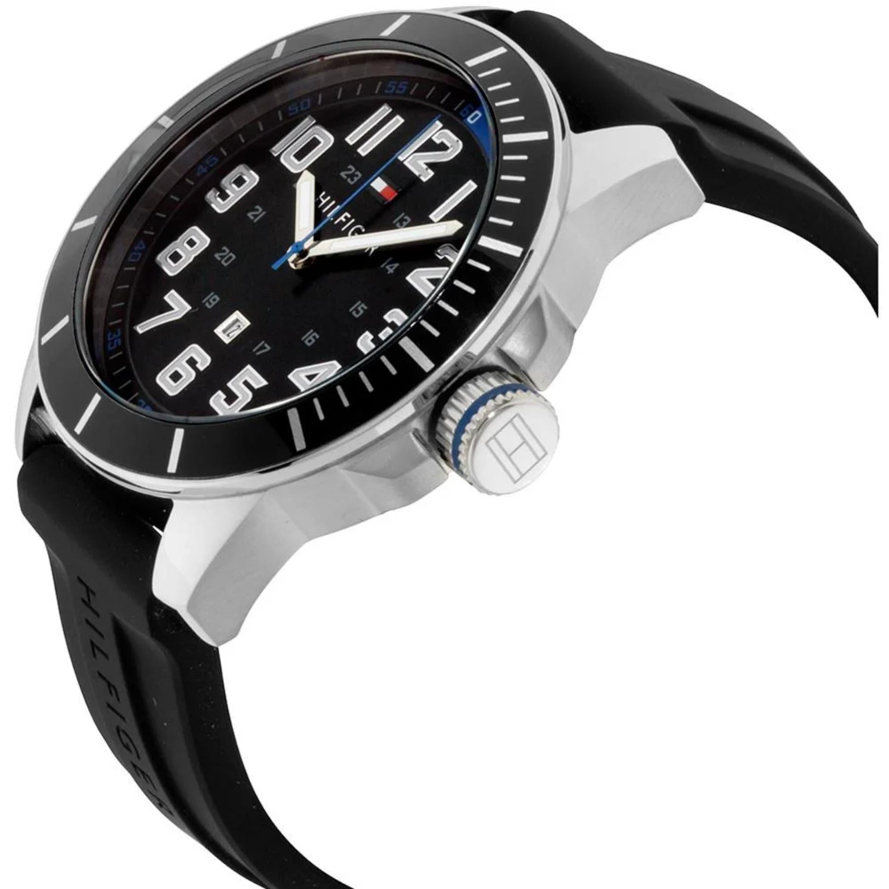 Tommy Hilfiger 179102 men’s sport watch with black dial, silver-tone case, blue crown accent, and black silicone strap shown in an angled close-up view.