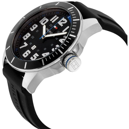 Tommy Hilfiger 179102 men’s sport watch with black dial, silver-tone case, blue crown accent, and black silicone strap shown in an angled close-up view.