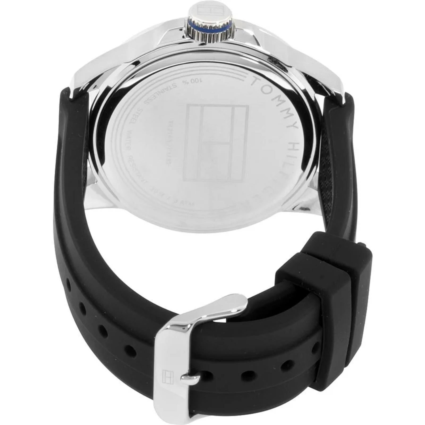 Tommy Hilfiger 179102 rear view showing the stainless steel caseback, black silicone strap, and silver-tone buckle closure.