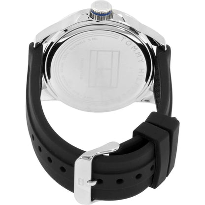 Tommy Hilfiger 179102 rear view showing the stainless steel caseback, black silicone strap, and silver-tone buckle closure.