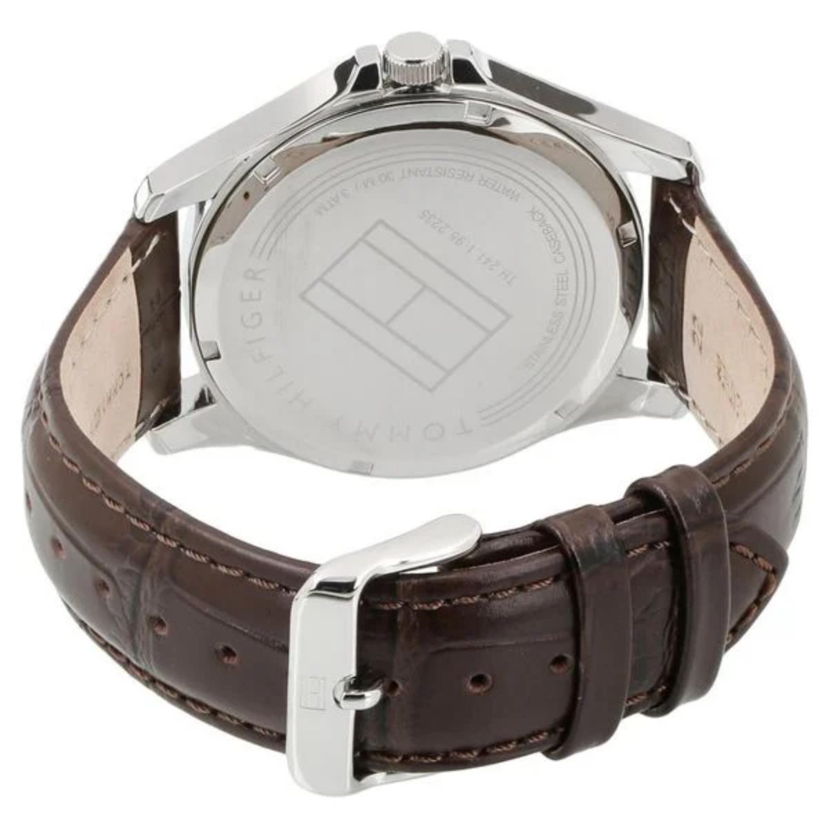 Tommy Hilfiger 1791449 rear view showing the stainless steel caseback, brown crocodile-pattern leather strap, and silver-tone buckle clasp.