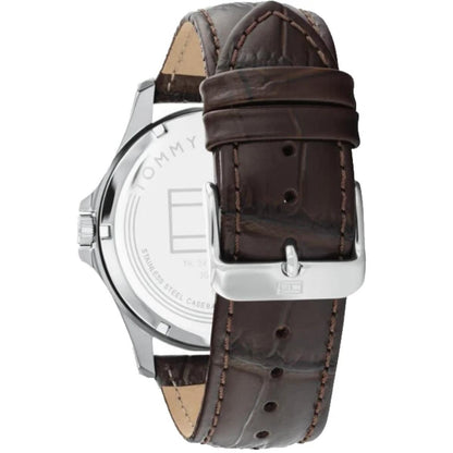 Tommy Hilfiger 1791449 rear view showing the stainless steel caseback, brown crocodile-pattern leather strap, and silver-tone buckle closure.