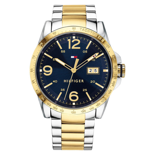 Tommy Hilfiger 1791453 quartz watch with blue dial, date display, gold-tone bezel and two-tone stainless steel bracelet.