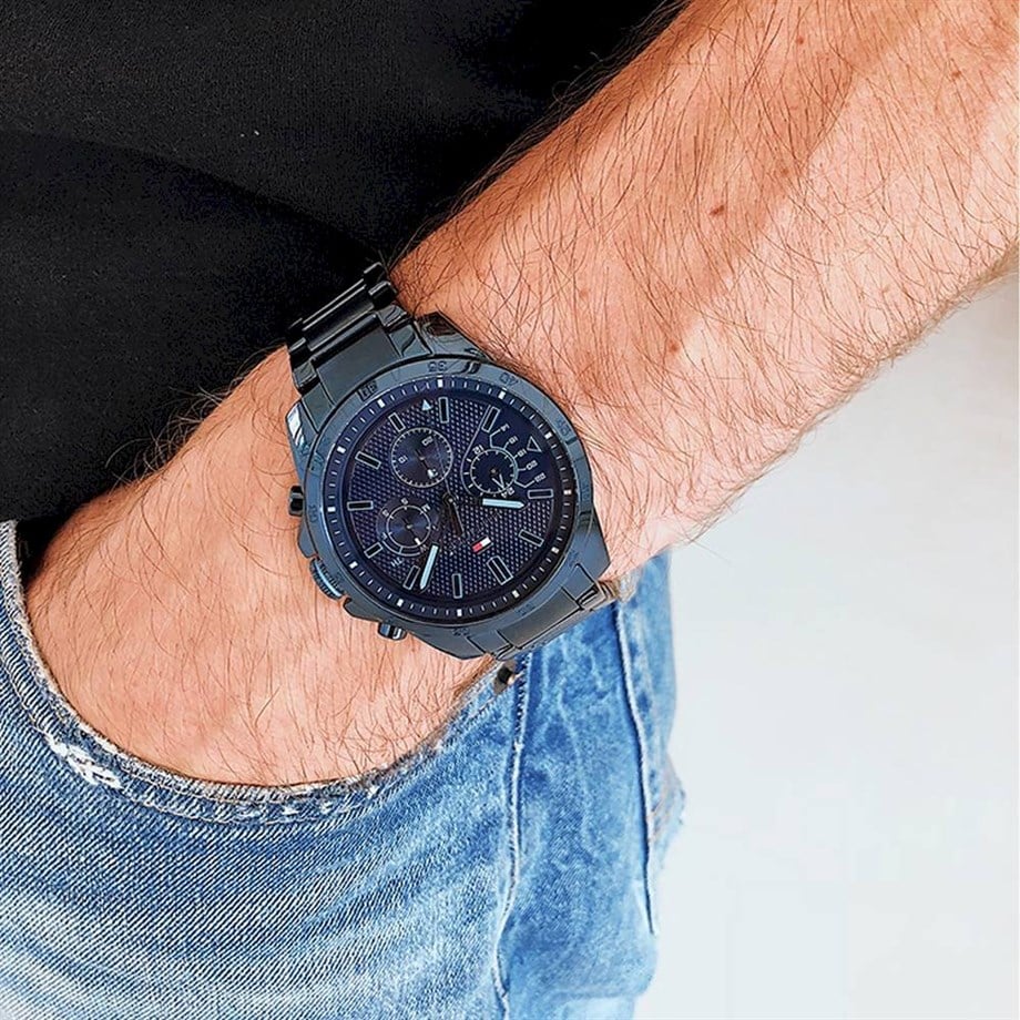 Tommy Hilfiger 1791560 men’s chronograph watch with blue textured dial and blue stainless steel bracelet worn on the wrist.