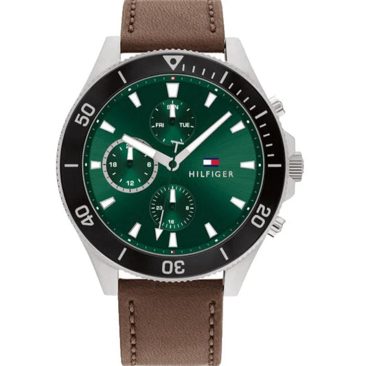 Tommy Hilfiger 1791983 men’s multifunction watch with green dial, black bezel, silver-tone case, and brown leather strap.