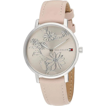 reloj Tommy Hilfiger para mujer con esfera clara grabada con flores, caja redonda plateada y correa rosa de acabado liso