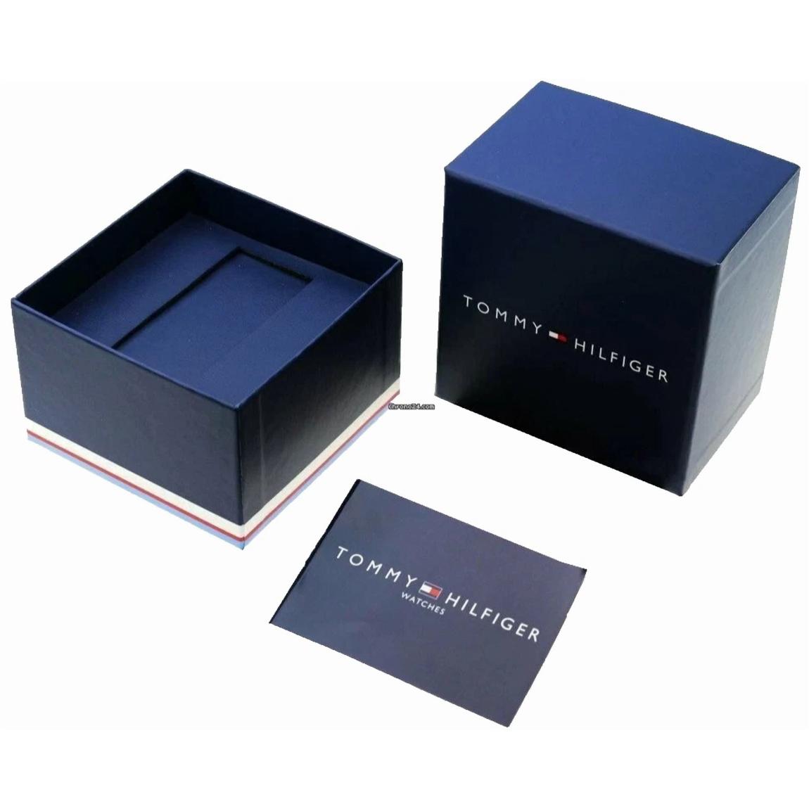 Tommy Hilfiger watch presentation box in navy blue with branded packaging and warranty booklet included.