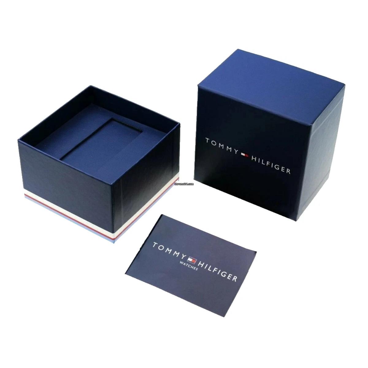 Tommy Hilfiger watch presentation box in navy blue with branded packaging and warranty booklet included.